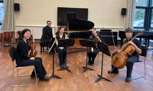Our five music students sitting after playing